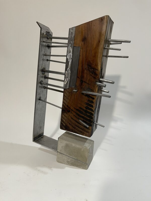 table-top sculpture: steel, concrete, and wood.