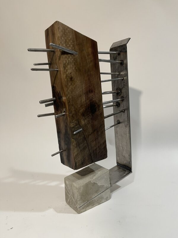 table-top sculpture: steel, concrete, and wood.