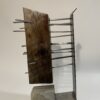 table-top sculpture: steel, concrete, and wood.