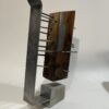 table-top sculpture: steel, concrete, and wood.