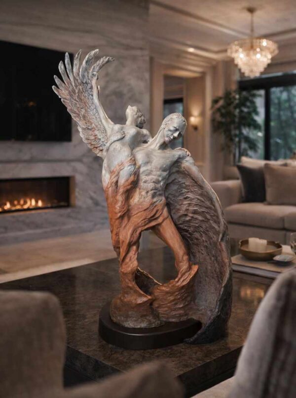 insitu view: figurative sculpture of a man and woman rising from a swirl. man has a devil wing, woman has an angel wing.